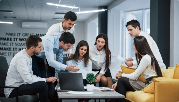 guy-shows-document-girl-group-young-freelancers-office-have-conversation-working@2x